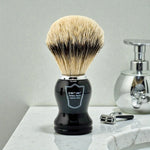 Parker silvertip badger shaving brush standing on a bathroom counter